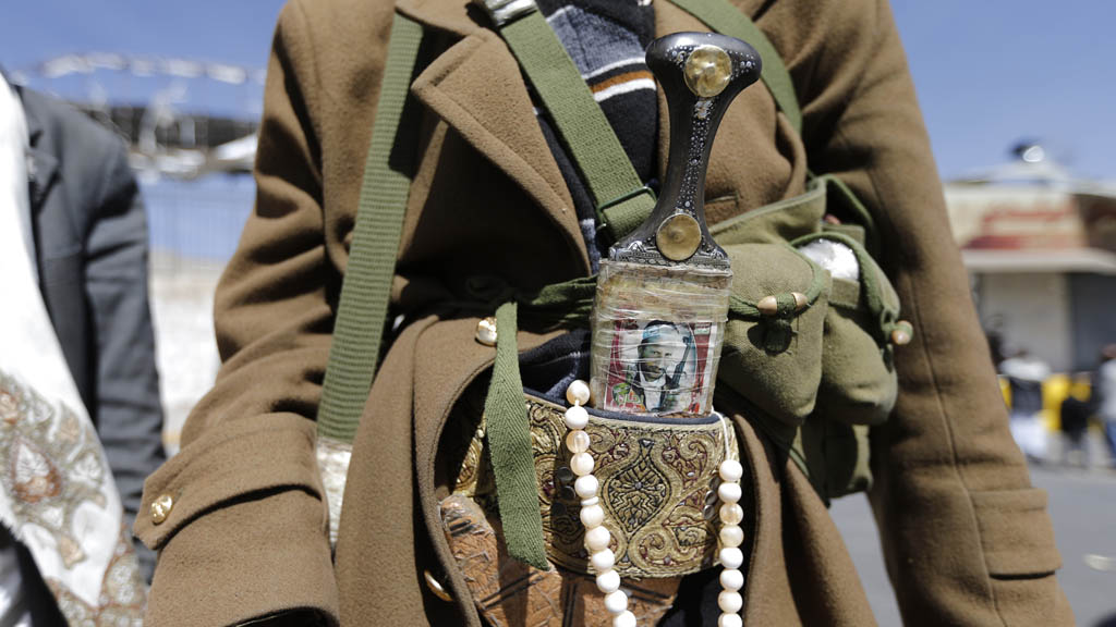 Houthi fighter outside the presidential guards' barracks in Sana'a