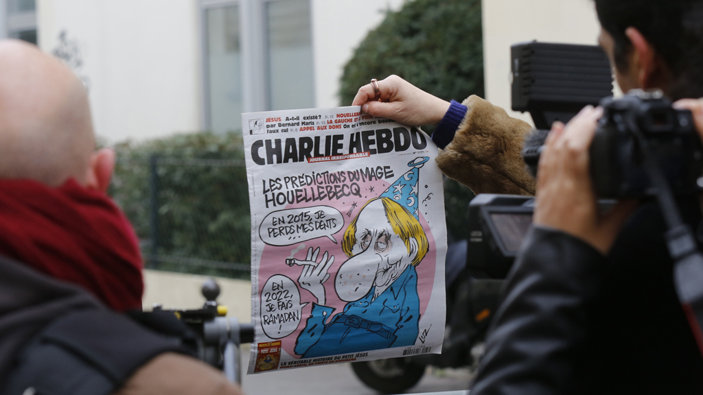 It is an unnerving coincidence: as Michel Houellebecq's controversial new novel was published on Wednesday, terrorists raided the offices of Charlie Habdo and murdered 12 people (Reuters)