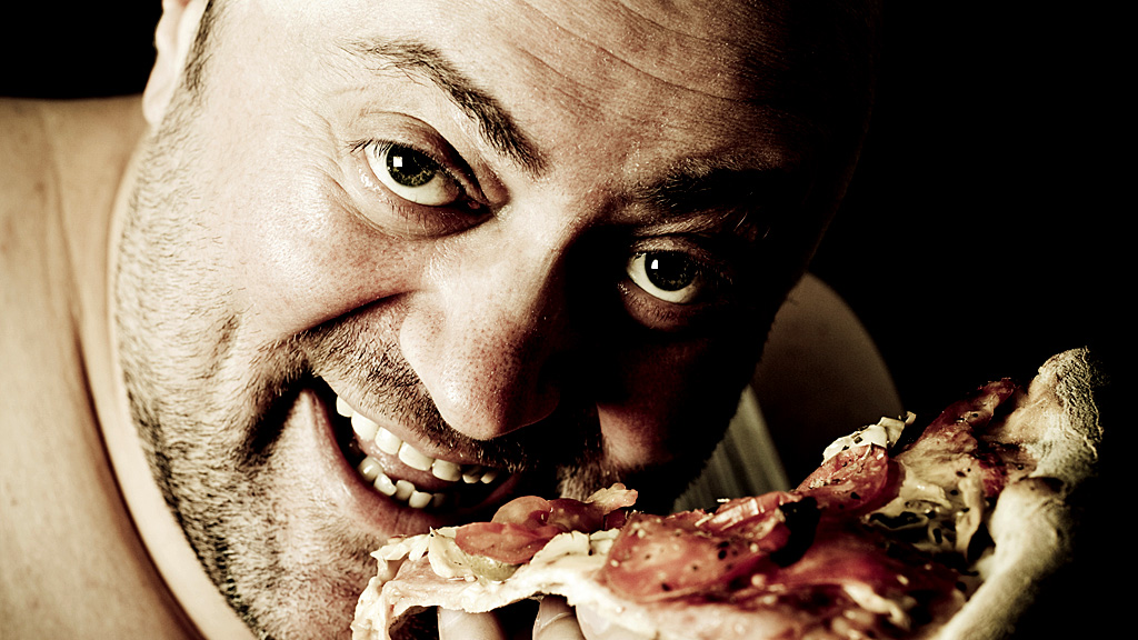 Man eating pizza (Getty Images)