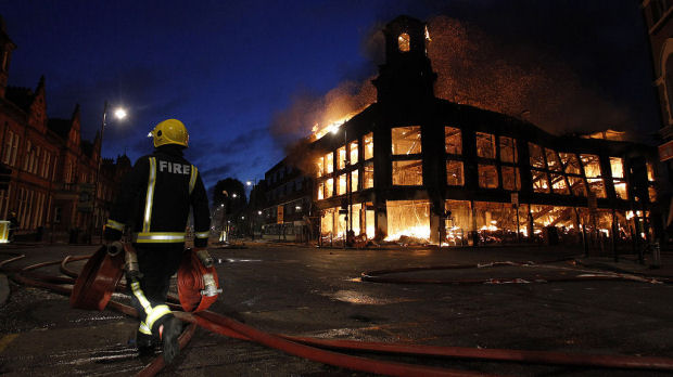 The burning Carpetright store in Tottenham High Road (Reuters)