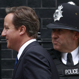 Cameron vow as police row simmers (Reuters)