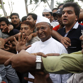 Social activist Anna Hazare (centre) who has been arrested ahead of a planned hunger strike in protest against corruption in India (Reuters)