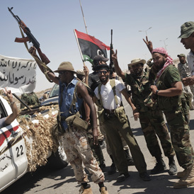 Libya's rebels man a checkpoint in Brega on August 16