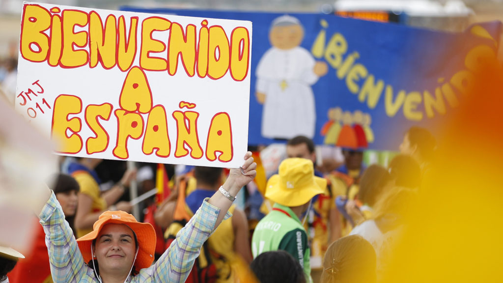 Supporters gather to welcome the Pope to Spain (Reuters)