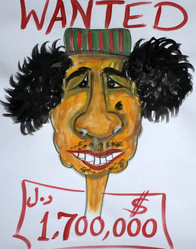 A wanted poster for Gaddafi in Libya (Getty)