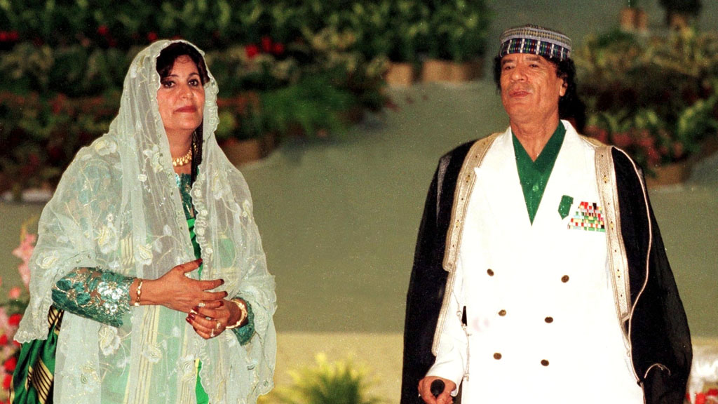 Colonel Gaddafi and his wife Safiya who has fled to Algeria with their daughter and two sons (Getty)