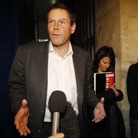 FSA boss Hector Sants leaving meeting with Occupy London (Reuters)