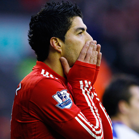 Suarez given eight-match ban for racism (reuters)