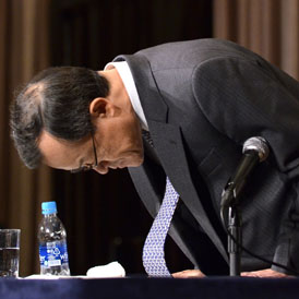 Olympus president Shuichi Takayama bows his head at a press conference in Tokyo on November 8, 2011. Olympus acknowledged wrongdoing for the first time (Getty)