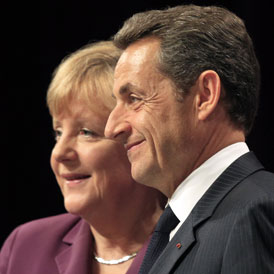 French President Nicolas Sarkozy and German Chancellor Angela Merkel disagree over the ECB's role (Reuters)