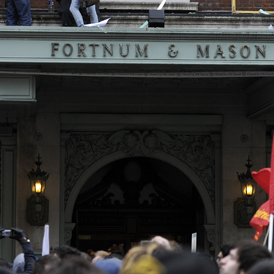 Demonstrators from UK Uncut protest at Fortnum and Mason. Ten have been found guilty of aggravated trespass (Reuters)