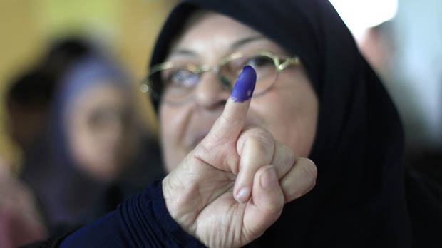 Egyptian woman casts vote in Egypt's elections (Reuters)