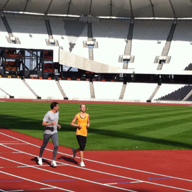 Lord Coe and Hannah England in first lap of the new Olympic stadium