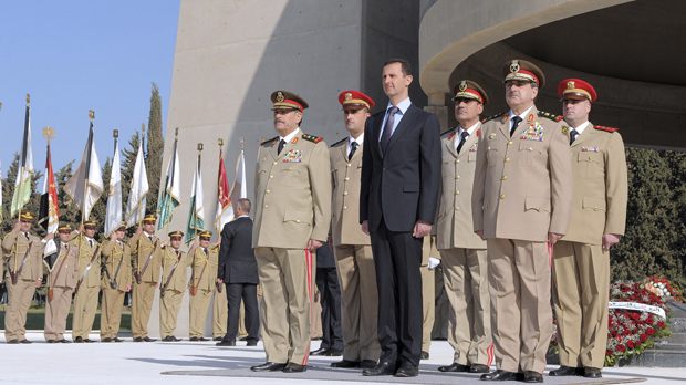 President Assad with military leaders at a ceremony in Damascus 