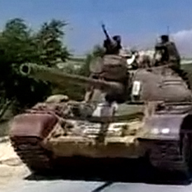 Military tanks drive into the Jabal Al-Zawya area of Idlib (Reuters)