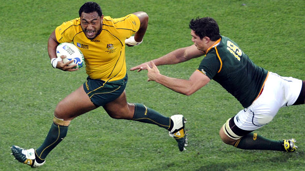 Australia put defending champions South Africa out of the Rugby World Cup, defeating them 11-9 in Wellington. In the other quarter-final, New Zealand overpowered Argentina 33-10. (Reuters)