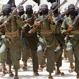 New recruits belonging to Somalia's al-Qaeda-linked al Shabaab rebel group march during a passing out parade at a military training base in Afgoye (Reuters)