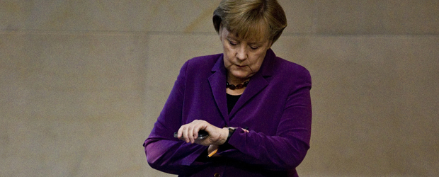 Eurozone: German Chancellor Angela Merkel checks her watch. (Getty)