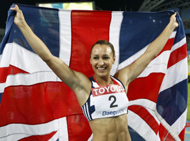 Ennis holds her national flag after placing second in the heptathlon at the IAAF World Athletics Championships in Daegu