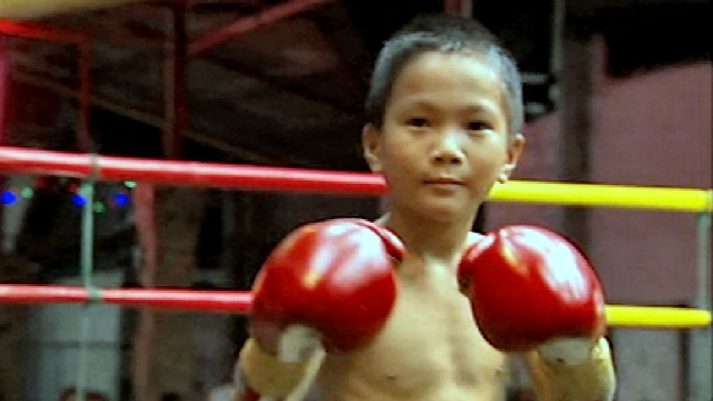 In Thailand, children as young a five earn cash by taking part in a version of boxing which uses elbows, knees and feet as well as fists. But medical experts say it is dangerous and want it banned.