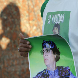 Gaddafi remains defiant and 'in Libya' (Reuters)