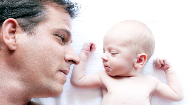 A man and a baby - a new study finds men experience a drop in testosterone when they become fathers (Getty)