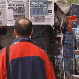A man reads newspapers in Greece as transport strikes bring country to a halt 