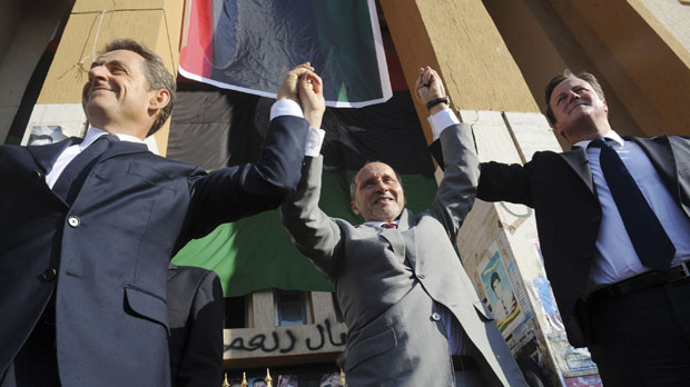 David Cameron and President Sarkozy with Mustafa Jalil of the Libyan NTC in Benghazi (Reuters)