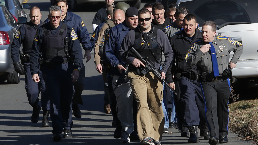 Connecticut shootings: armed police on patrol (Reuters)