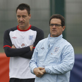 England dilemma: Fabio Capello and John Terry. (Reuters)