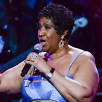 Houston's godmother Aretha Franklin (pictured).
