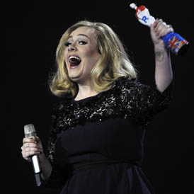 Pop star Adele caps year of colossal success by taking home two out of three awards in a triumphant return to the Brits. (Reuters)