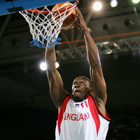 Michael Martin of England dunks in the men's bronze medal basketball game between England and Nigeria in 2006 (Getty)