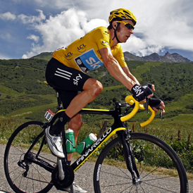 Bradley Wiggins riding in the tour de france wearing the leader's yellow jerse (Reuters)