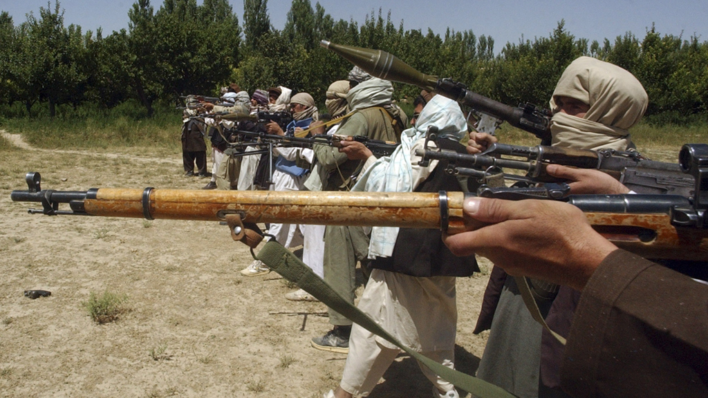 Taliban fighters train with their weapons in an undisclosed location in Afghanistan (Reuters)