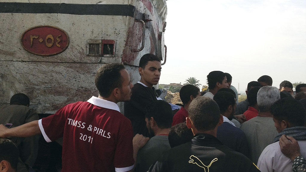 Relatives surround crash site in Manfalut (Reuters)