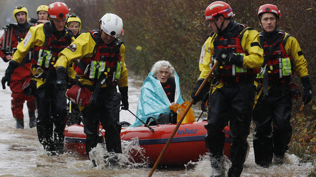 90-year-old Diana Mallows is rescued from her flooded home in Somerset (pic: Reuters) 