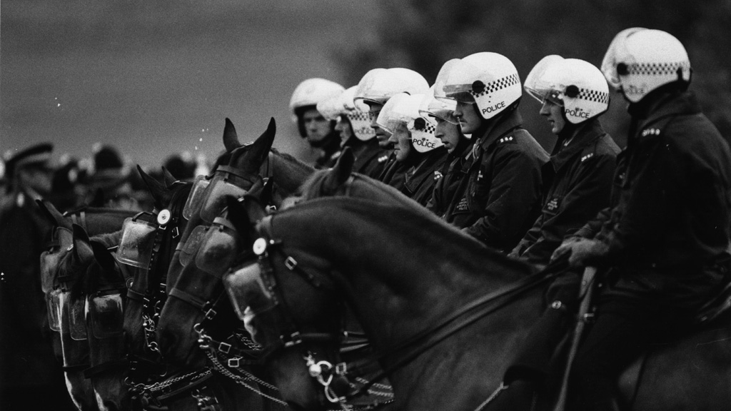Police on horseback line up outside the Orgreave coking plant in South Yorkshire during the miners strike (Getty)