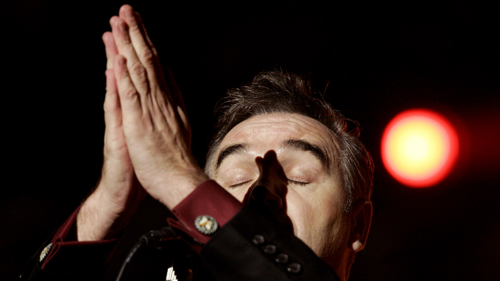 Morrissey 'prays' during a performance in Paris in 2006. (Reuters)