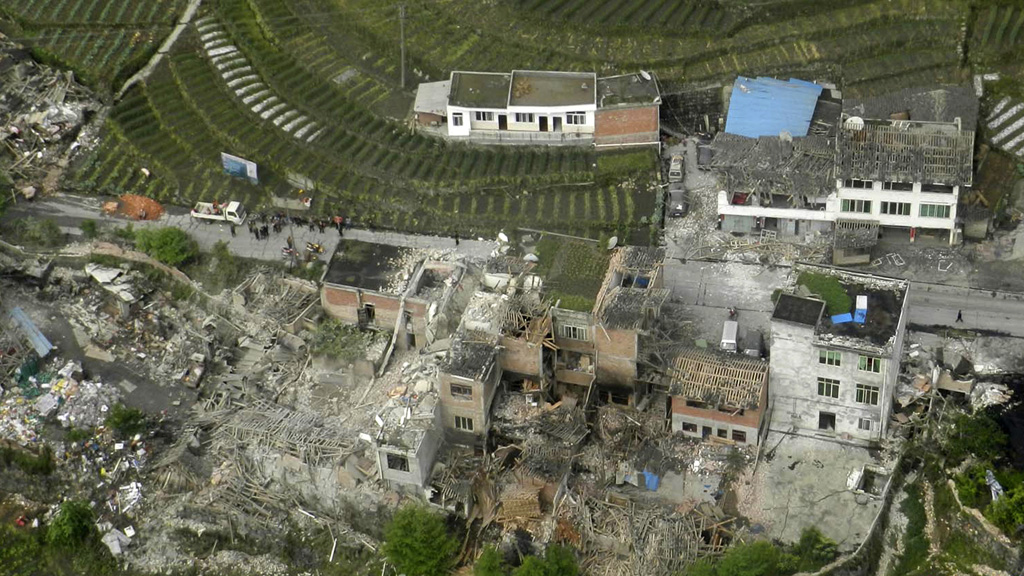 The earthquake destroyed buildings and triggered landslides (picture: Reuters)