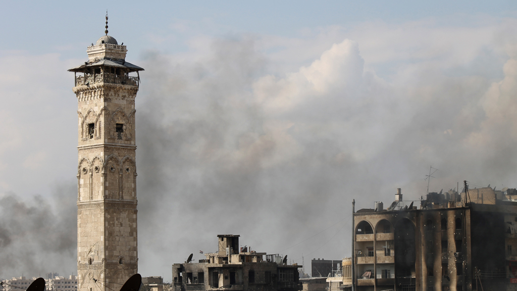 Video footage released by activists shows Syrian rebels fighting inside the Great Umayyad Mosque of Aleppo immediately after its famous minaret is destroyed. 