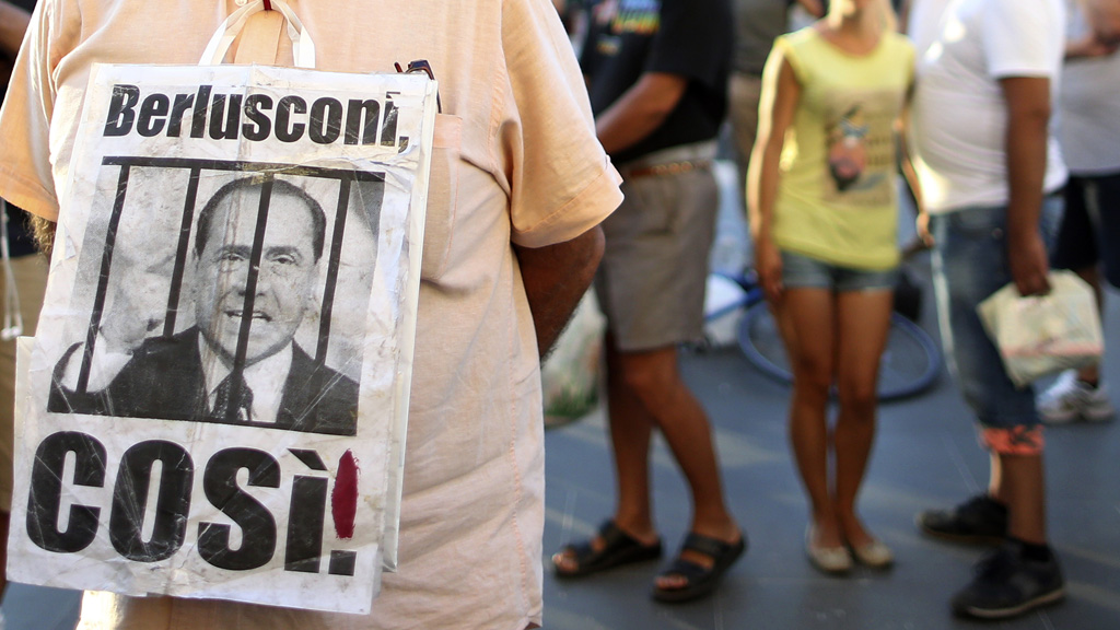 Anti-Berlusconi protesters outside court (Reuters)
