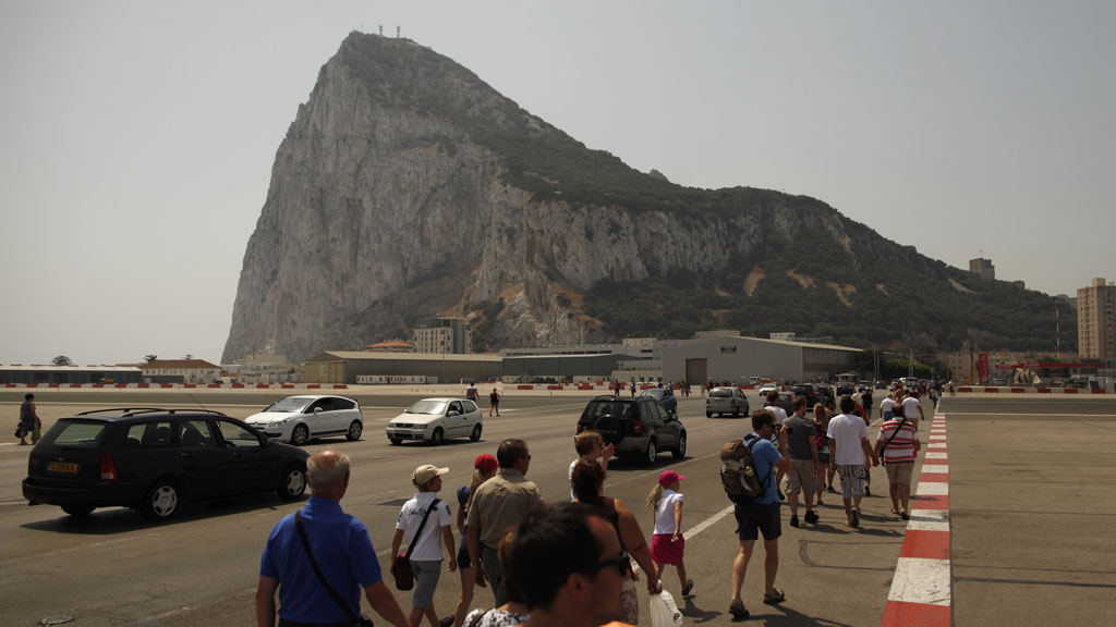Pedestrians and drivers cross the Spanish border into Gibraltar (pic: Reuters)