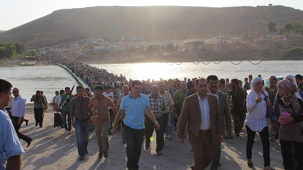 Thousands of Syrians streamed across a bridge over the Tigris River and into Iraq's Kurdistan region on Thursday, August 15th. UNHCR Field Officer, Galiya Gubaeva, was on the ground with her camera.