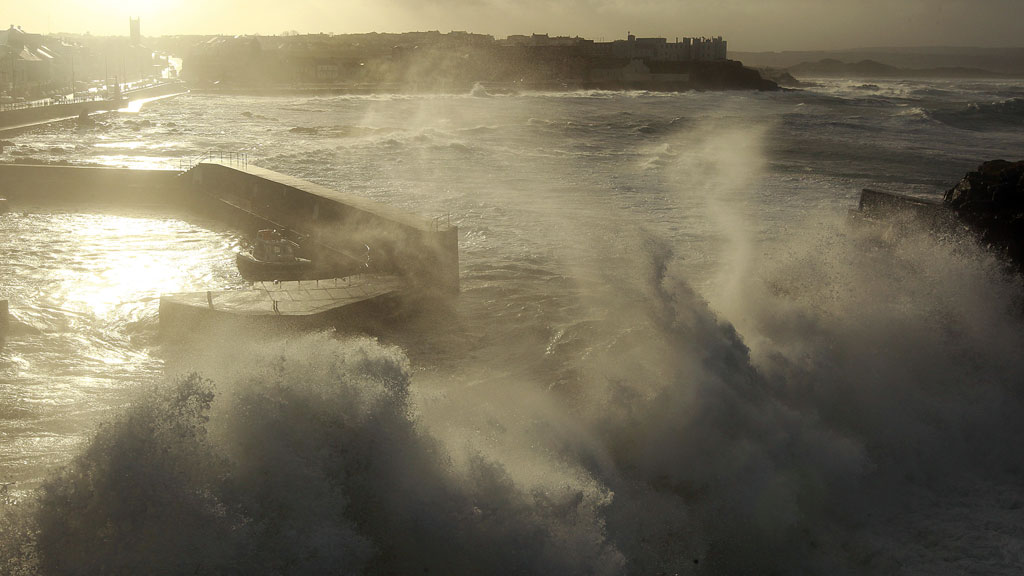 Waves crash against Portstewart Harbour as gale force winds hit the the north Antrim coast in northern Ireland (R)
