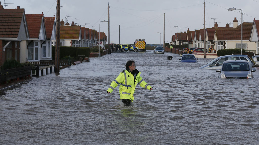 Emergency services rescue people from a flooded properties in Rhyl, north Wales (R)