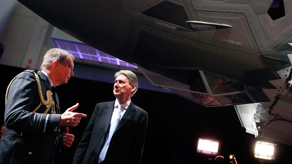British Air Marshall Sir Kevin Leeson (L) talks with British Secretary of State for Defense Philip Hammond (R) during the United Kingdom F-35 Lightning II Delivery Ceremony (picture: Getty)