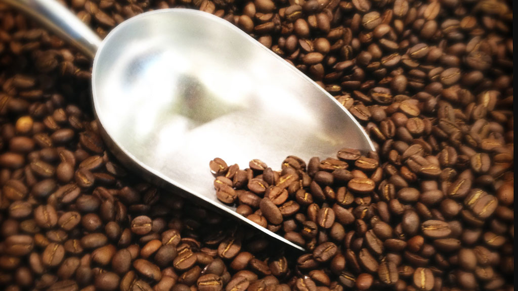 coffee beans with scoop (getty)