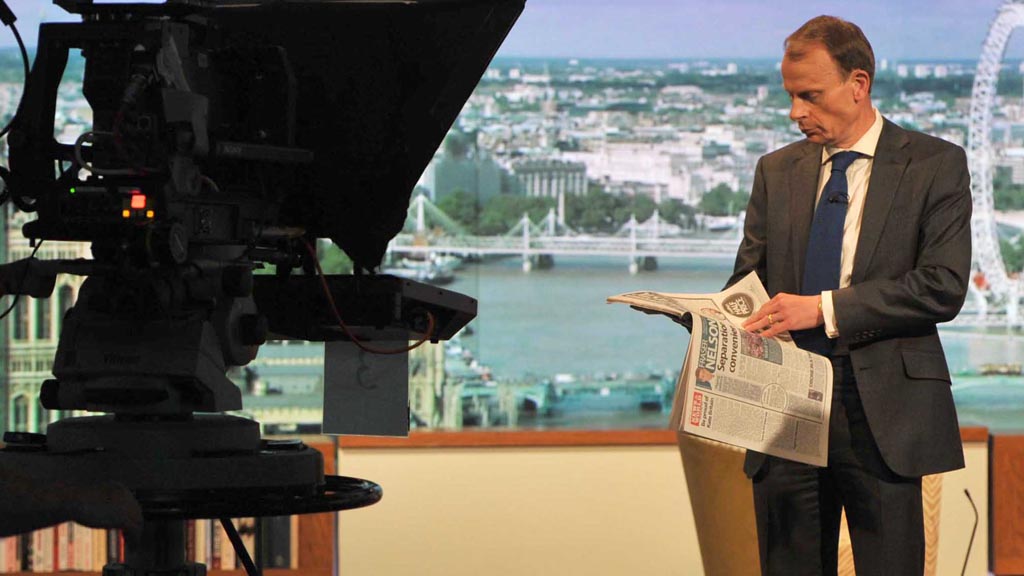 Andrew Marr reading a newspaper on The Andrew Marr Show (picture: Reuters)