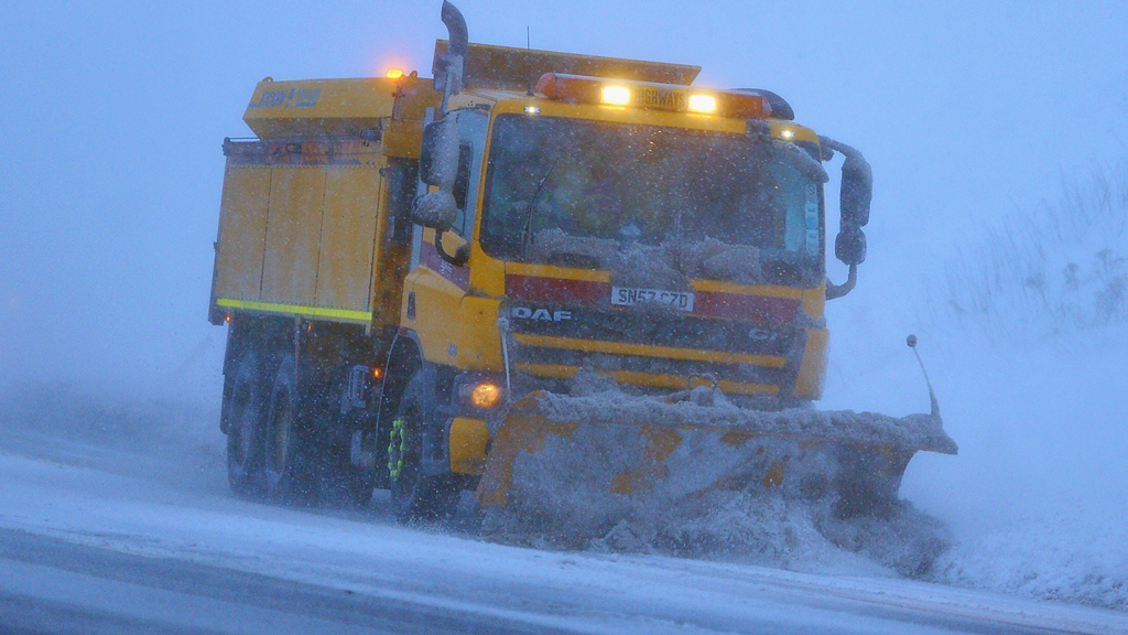 A snow plough makes way down the A68 on January 21, 2012 in Lauder, Scotland (Getty)